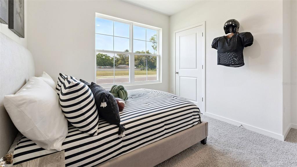 5276 Masser Road St. Cloud, FL 34772 - Photo 17 of 20 a view of a bedroom with furniture and windows