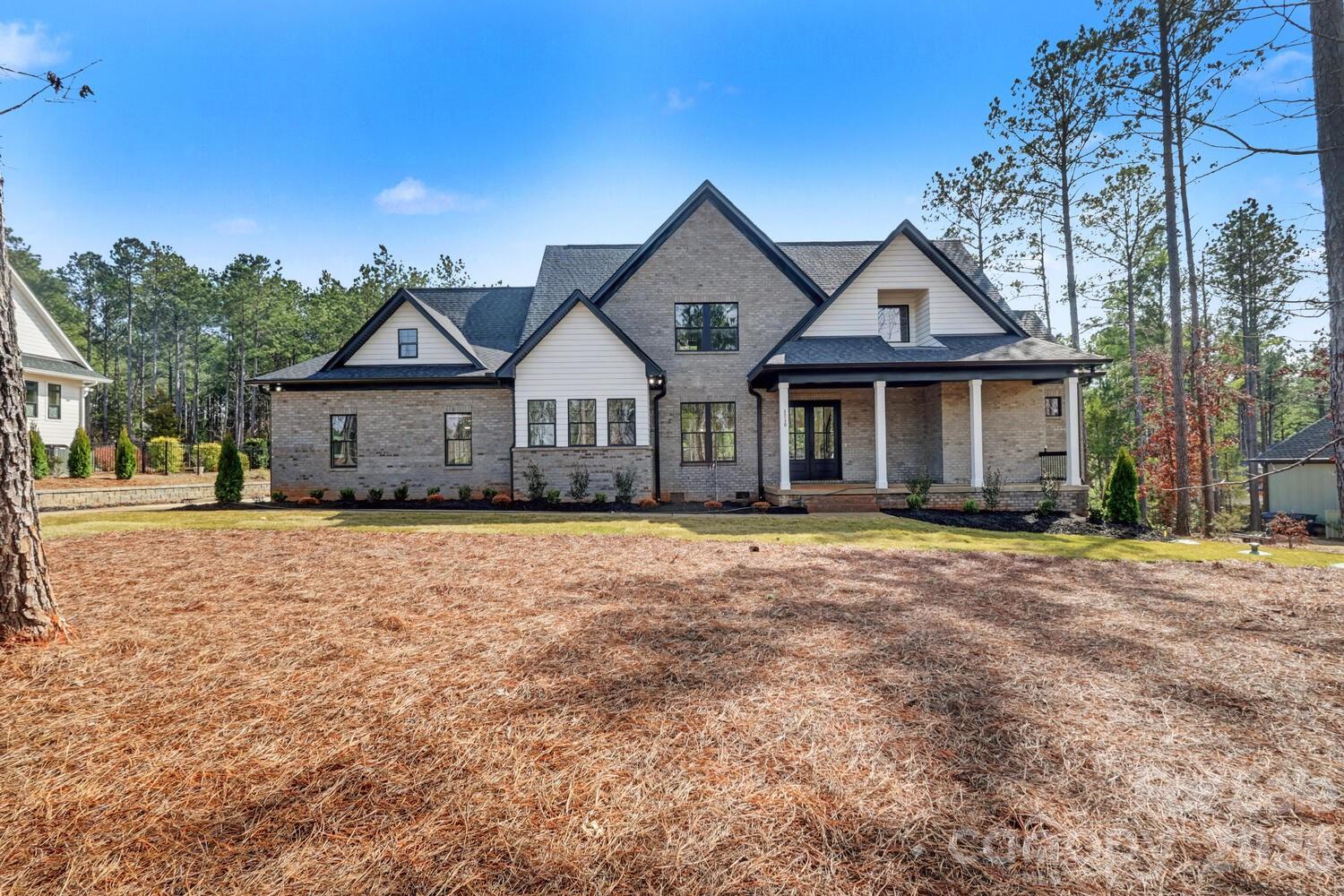 3210 Sherman Drive Lancaster, SC 29720 - Photo 1 of 44 a front view of a house with a garden
