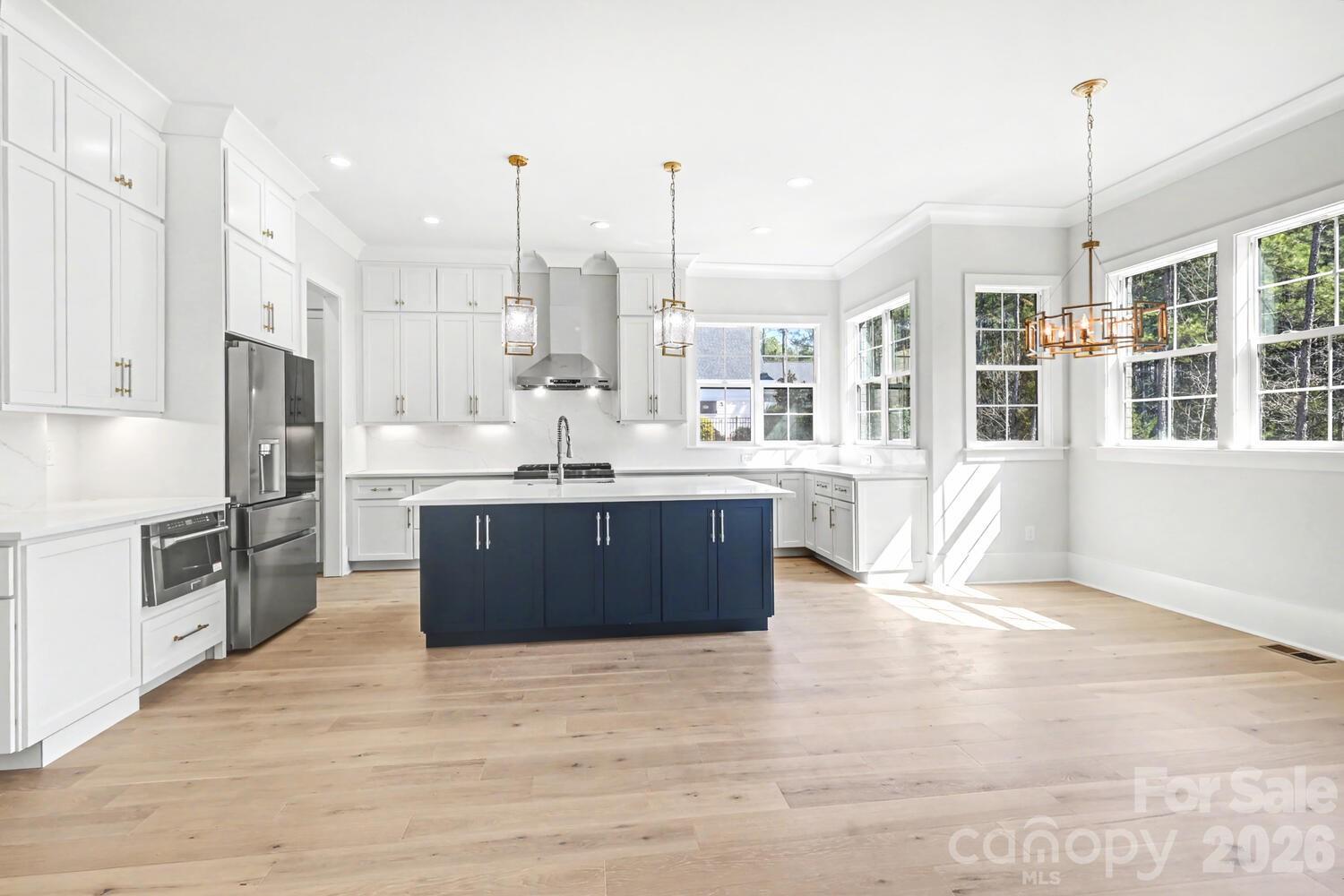 3210 Sherman Drive Lancaster, SC 29720 - Photo 12 of 44 a large kitchen with stainless steel appliances kitchen island granite countertop a large counter top stainless steel appliances and cabinets