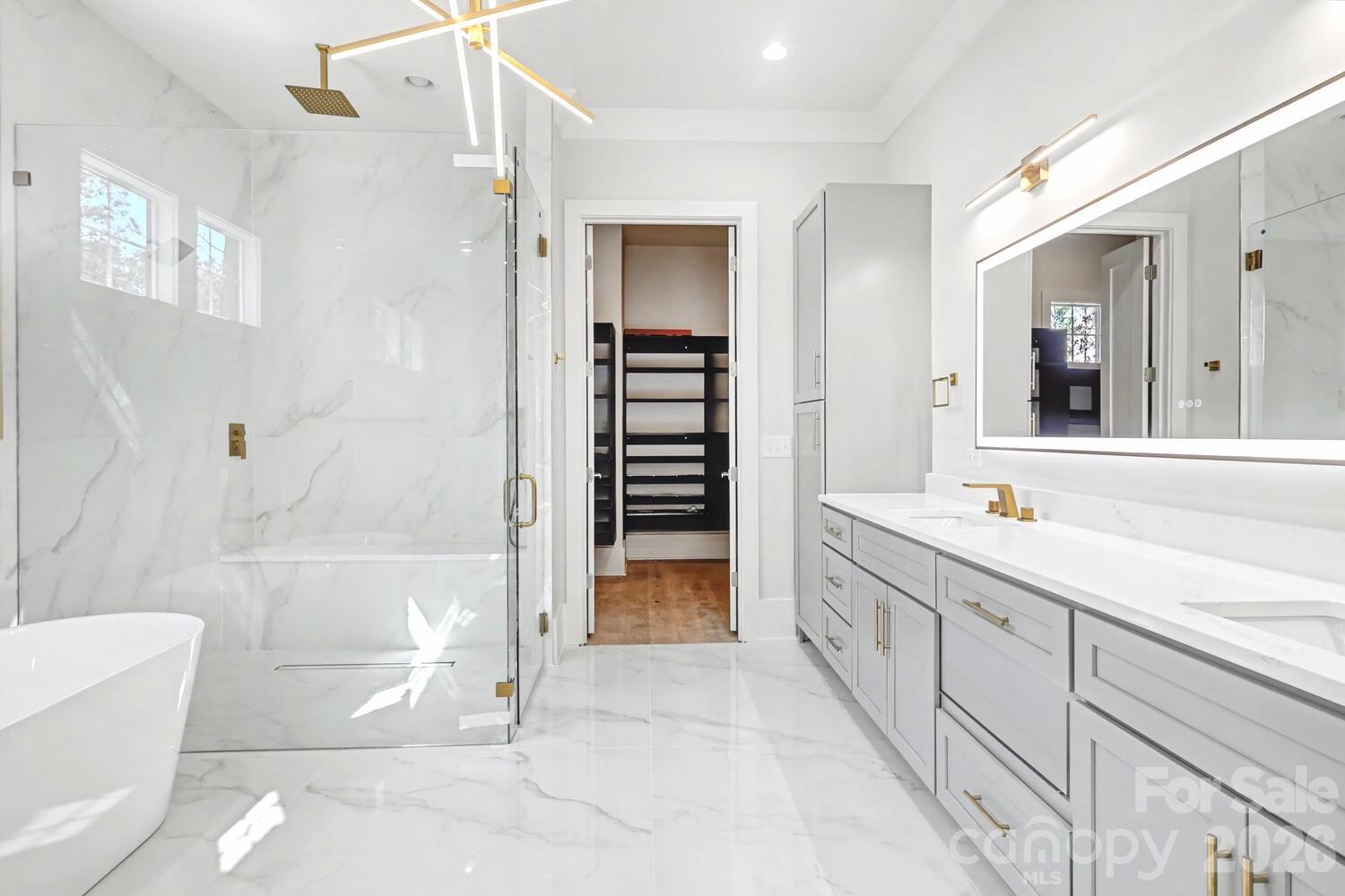 3210 Sherman Drive Lancaster, SC 29720 - Photo 22 of 44 a bathroom with a granite countertop sink mirror and bathtub
