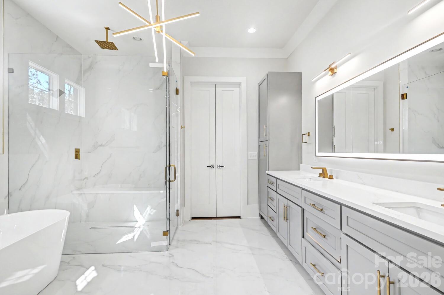 3210 Sherman Drive Lancaster, SC 29720 - Photo 24 of 44 a bathroom with a granite countertop sink a toilet a mirror and shower