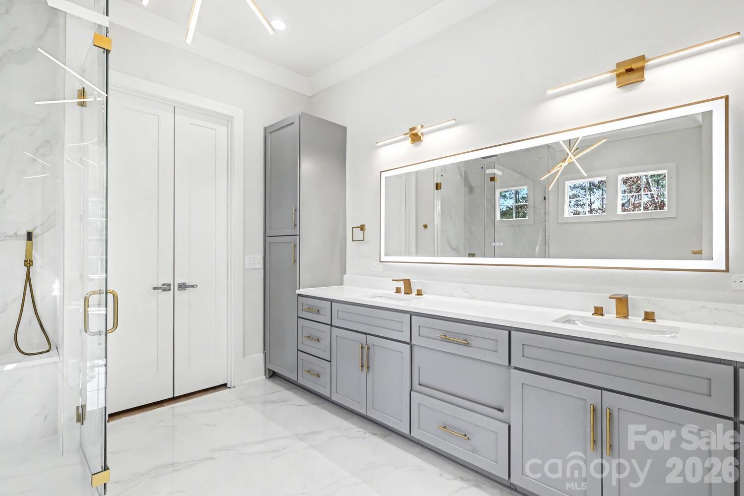 3210 Sherman Drive Lancaster, SC 29720 - Photo 24 of 45 a bathroom with a double vanity sink and a mirror