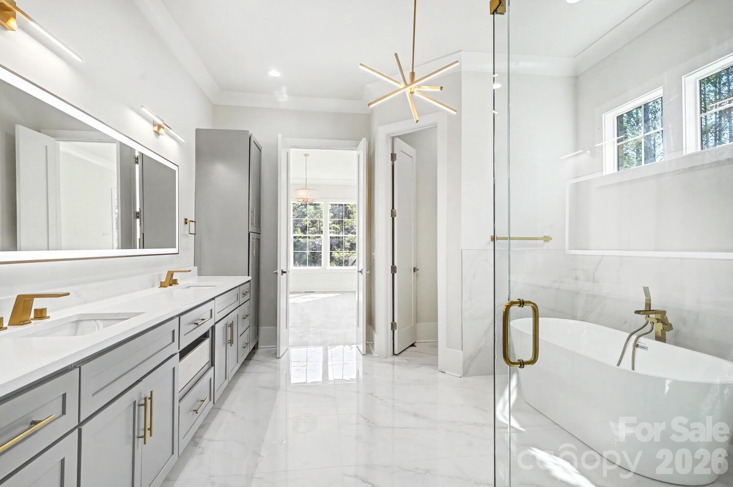 3210 Sherman Drive Lancaster, SC 29720 - Photo 29 of 44 a bathroom with a tub sink and mirror