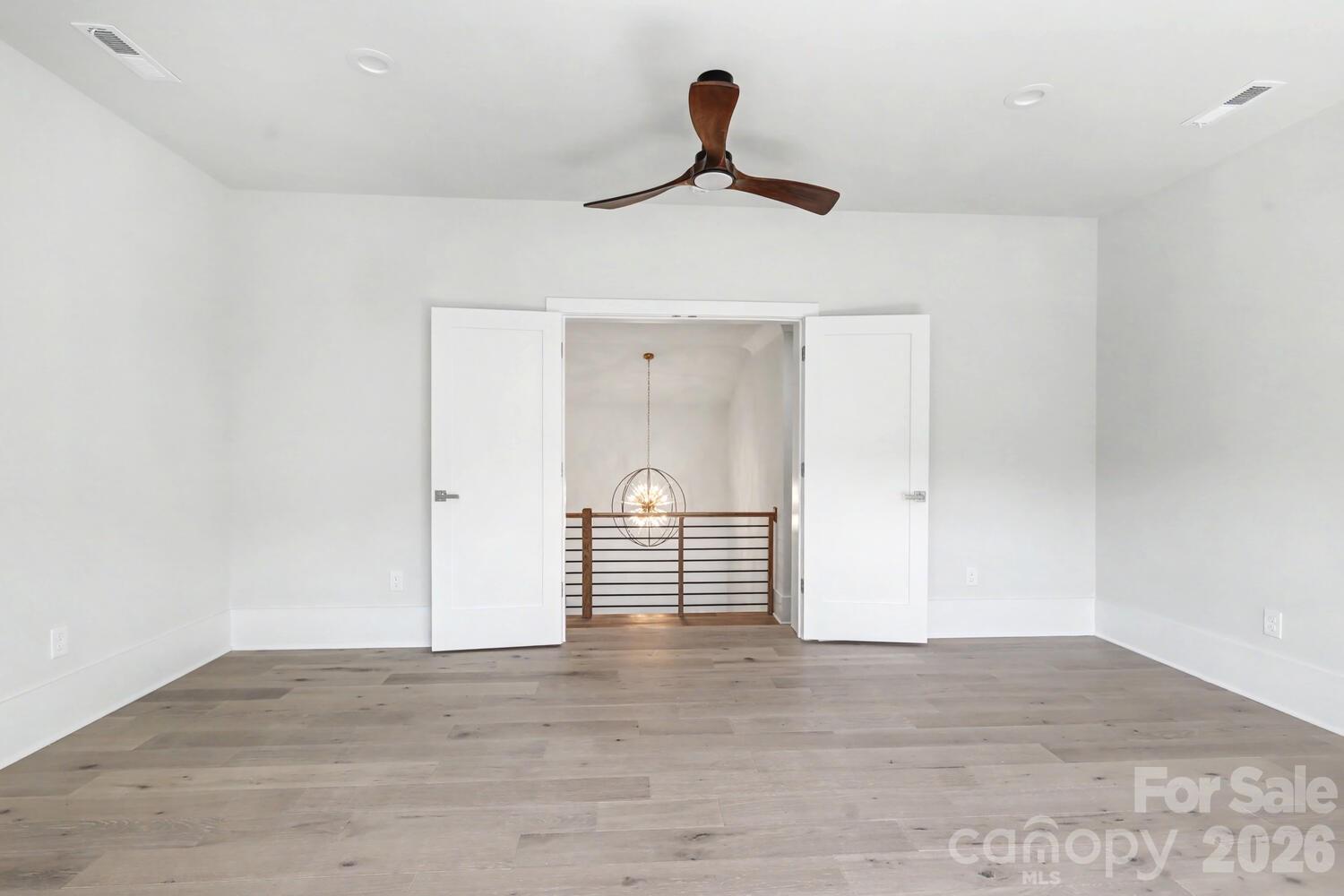 3210 Sherman Drive Lancaster, SC 29720 - Photo 29 of 45 a view of empty room with wooden floor and fan