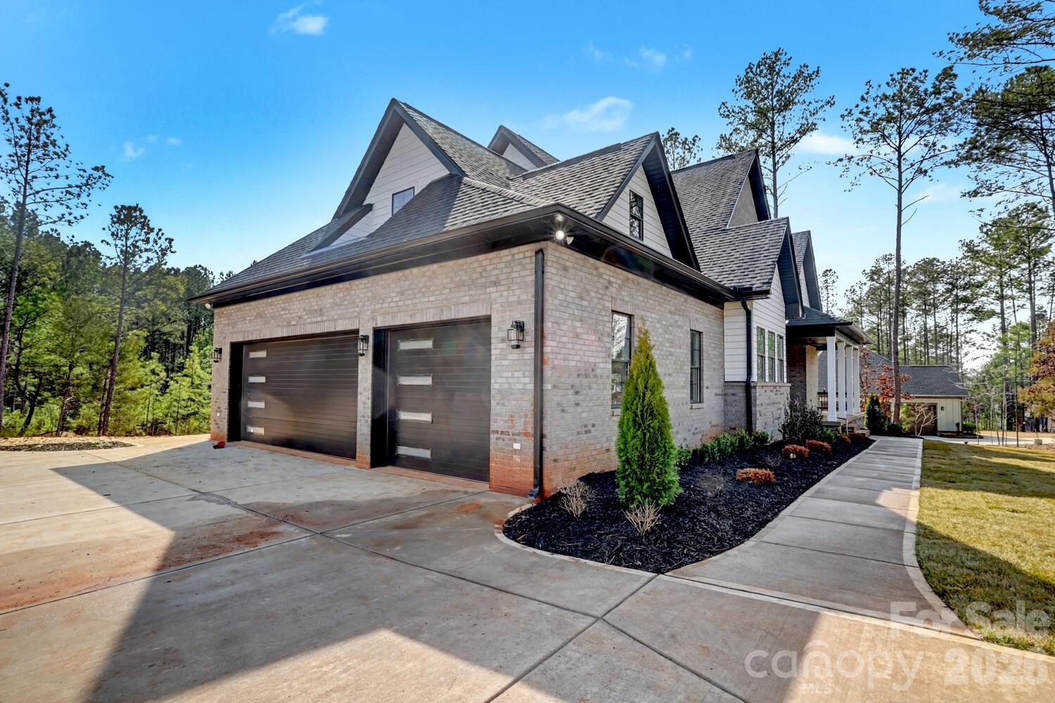 3210 Sherman Drive Lancaster, SC 29720 - Photo 40 of 44 a front view of a house with garden