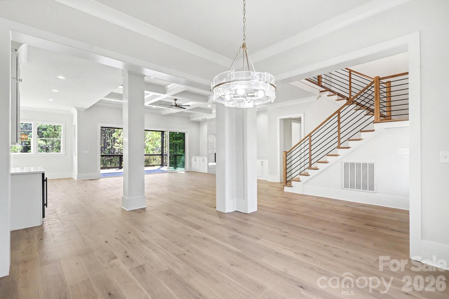 3210 Sherman Drive Lancaster, SC 29720 - Photo 5 of 44 a view of a livingroom with wooden floor staircase and a kitchen