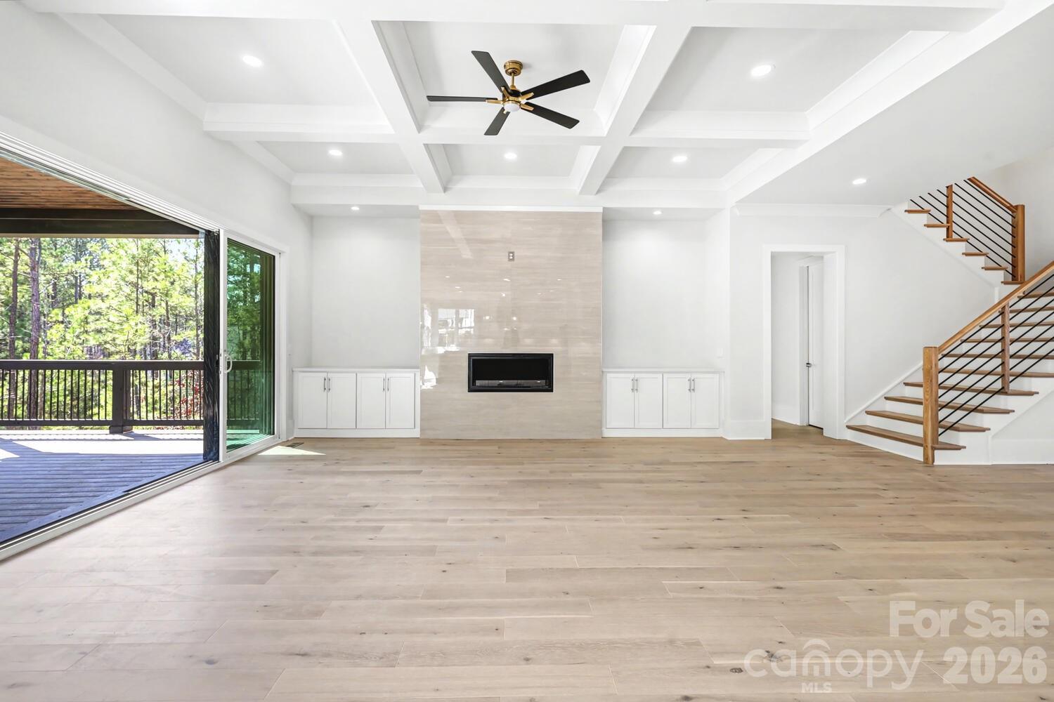 3210 Sherman Drive Lancaster, SC 29720 - Photo 6 of 44 a view of an empty room with a fireplace and a large window