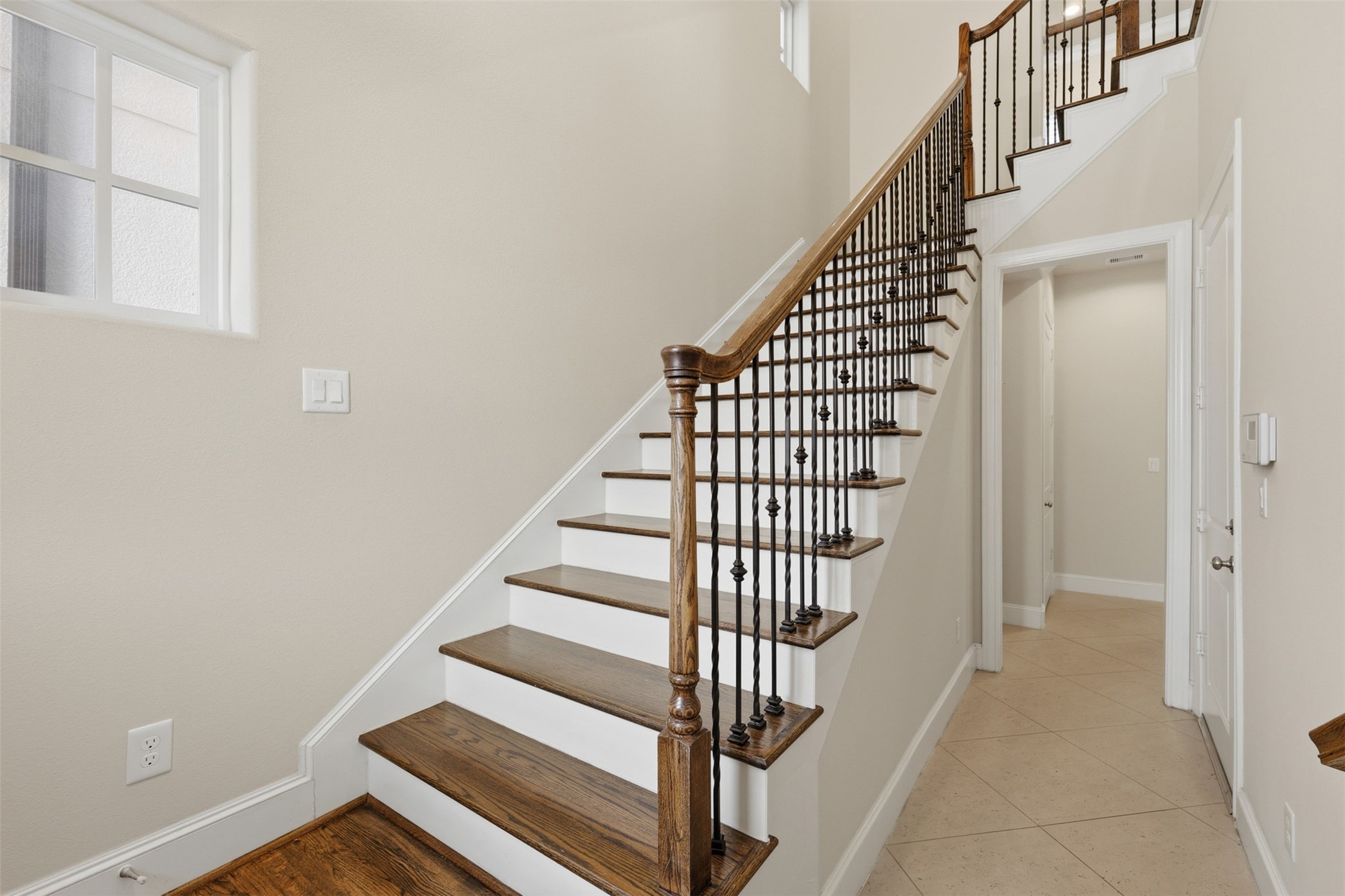 2707 Cohn Trails Lane Houston, TX 77007 - Photo 9 of 42 First floor staircase up to the second floor living and kitchen