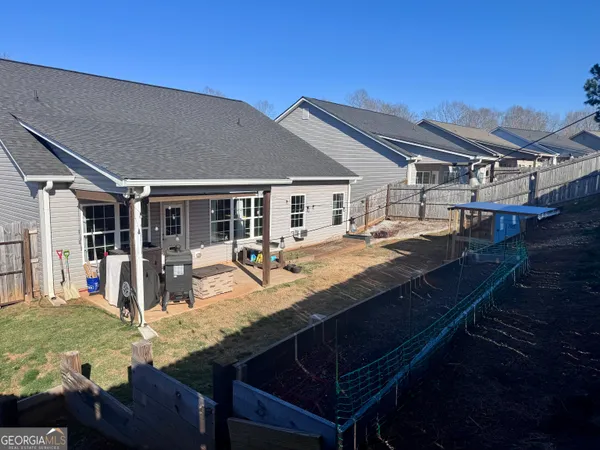 a view of house with patio outdoor seating