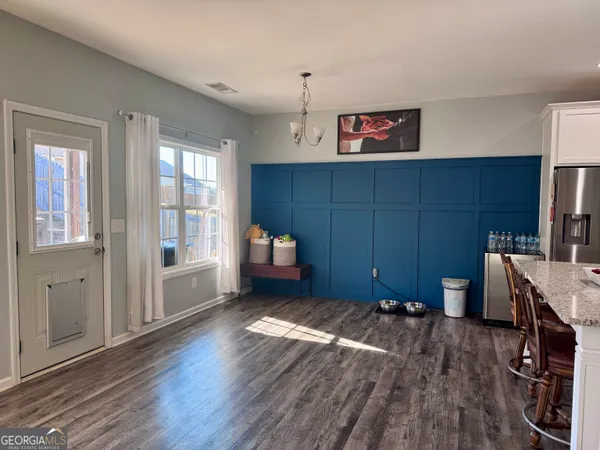a view of a room with window and wooden floor