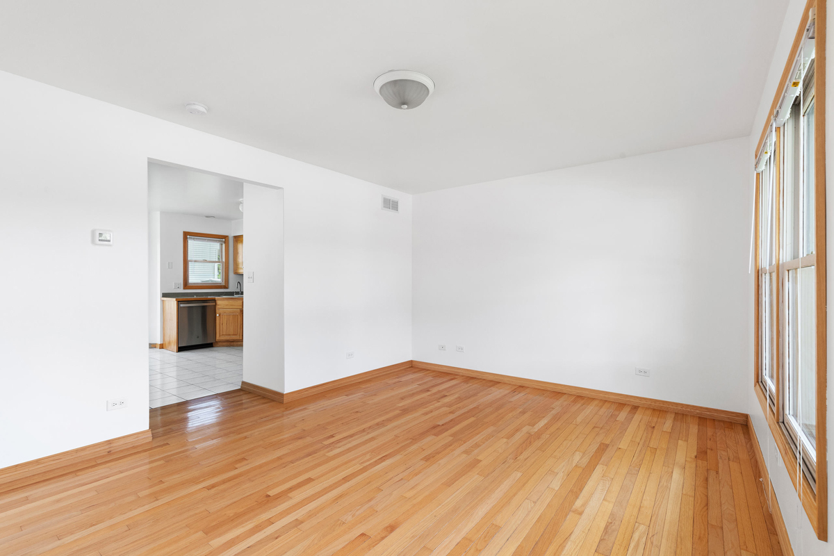426 East 5th Street Lockport, IL 60441 - Photo 11 of 20 wooden floor in an empty room with a window
