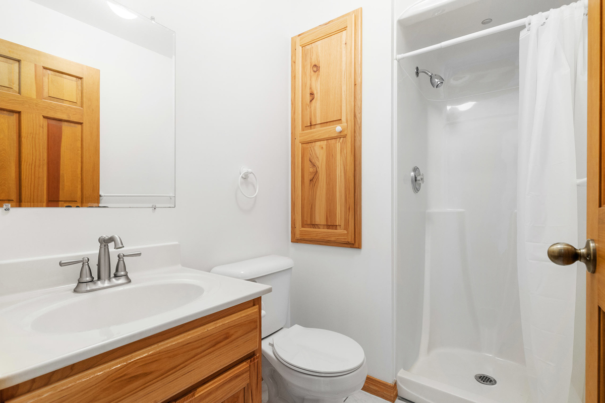 426 East 5th Street Lockport, IL 60441 - Photo 9 of 20 a bathroom with a sink a toilet and shower
