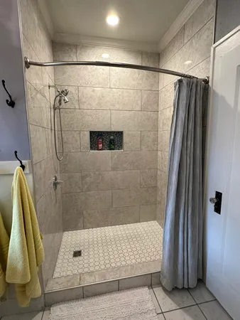 a bathroom with a shower and a tub