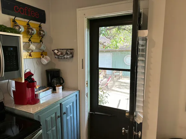 a bathroom view of a fireplace and a window