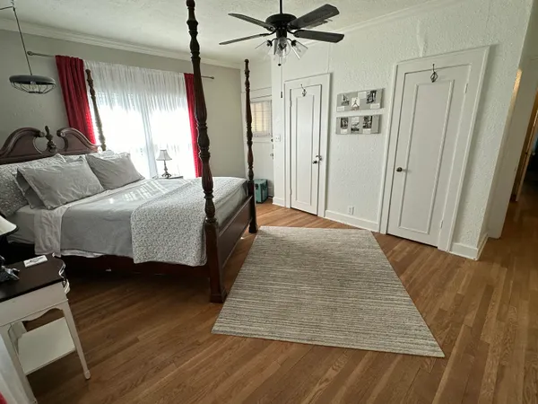 a bed room with a bed and a mirror