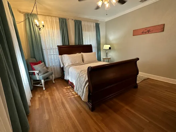 a bedroom with a bed and a mirror