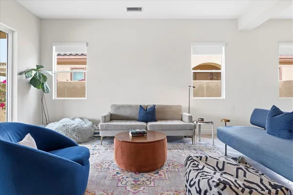 a living room with furniture and a large window