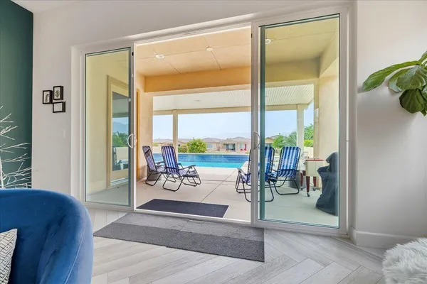 a view of a livingroom with furniture and lounge chair