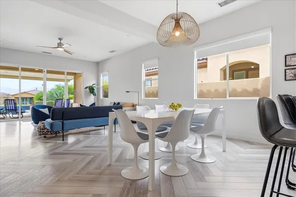 a dining room with furniture and window