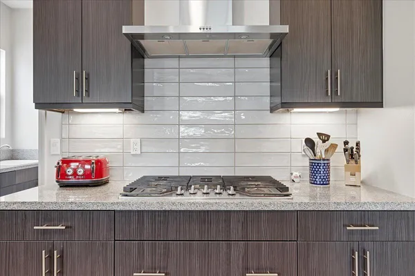 a kitchen with granite countertop a sink and a window