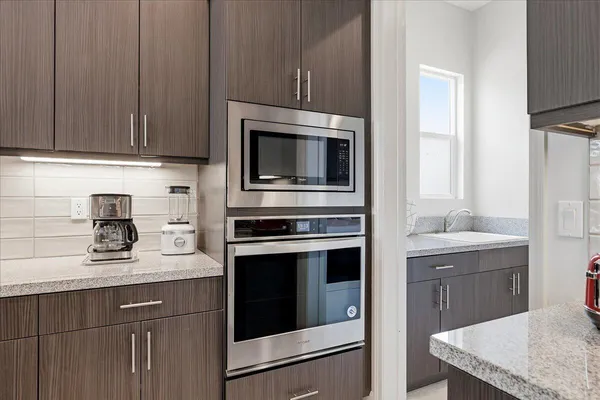 a kitchen with a stove and cabinets