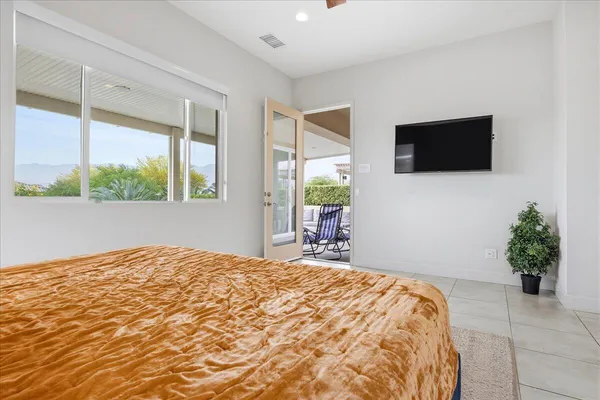 a bedroom with a bed and window