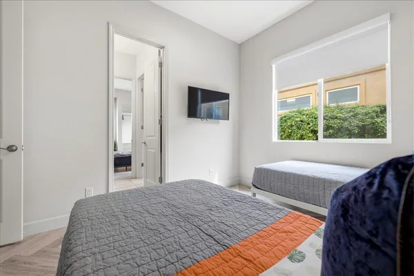 a bedroom with a bed and a lamp