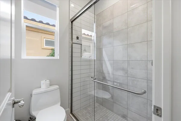 a bathroom with double sink and a mirror