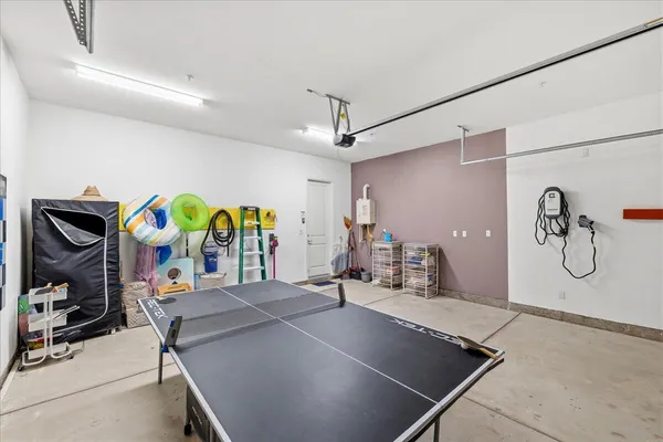 a room with furniture and white walls