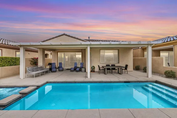 a view of a house with kitchen and sitting area