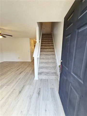 a view of entryway with wooden floor