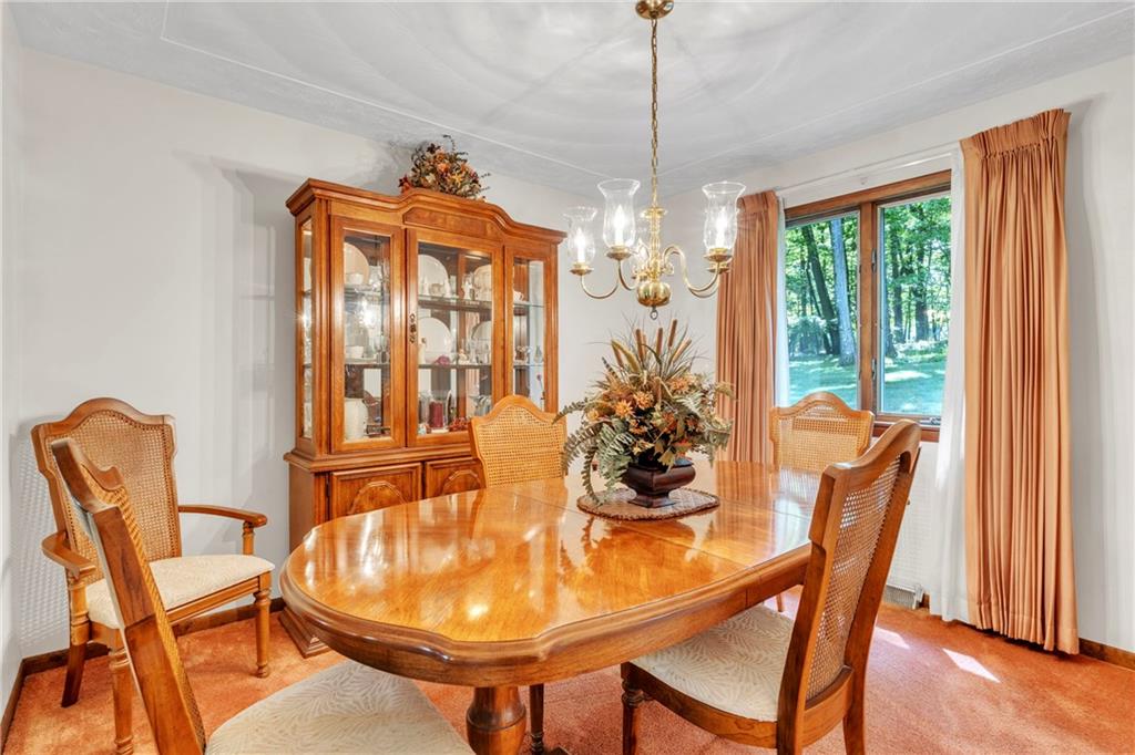 454 Cherokee Drive Butler, PA 16001 - Photo 14 of 31 a dining room with furniture a chandelier and wooden floor