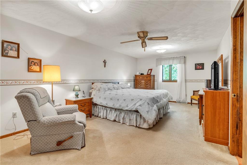 454 Cherokee Drive Butler, PA 16001 - Photo 22 of 31 a bedroom with a bed and couch