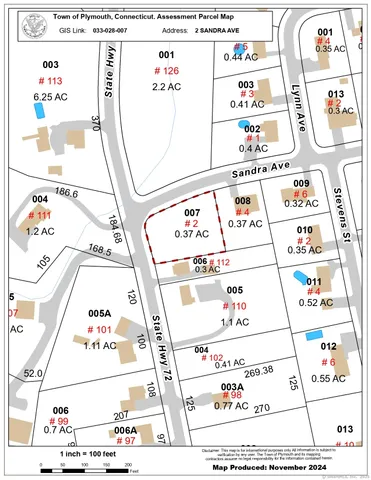 a window with a white comforter and table