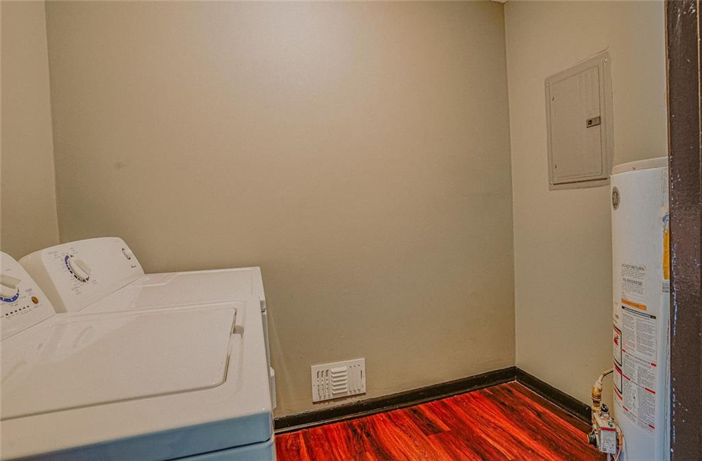 2877 Whispering Hills Drive, Unit 2875 Atlanta, GA 30341 - Photo 14 of 18 a utility room with dryer and washer