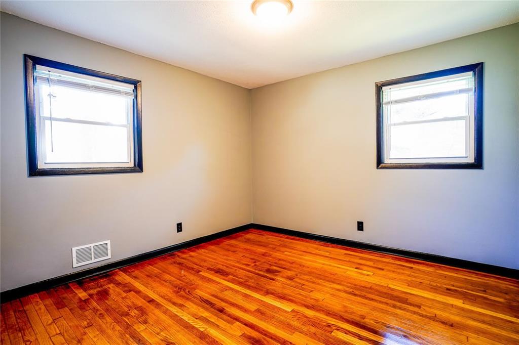 2877 Whispering Hills Drive, Unit 2875 Atlanta, GA 30341 - Photo 7 of 18 an empty room with a window