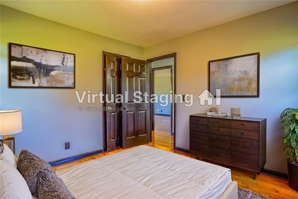 2877 Whispering Hills Drive, Unit 2875 Atlanta, GA 30341 - Photo 8 of 18 a bedroom with a bed and a dresser