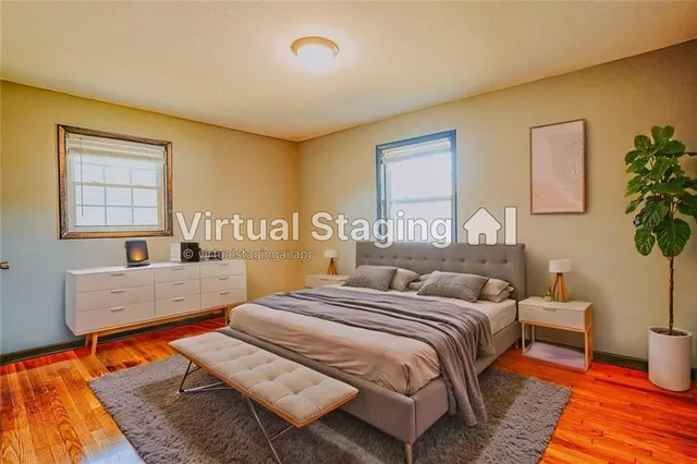 a spacious bedroom with a bed and a couch