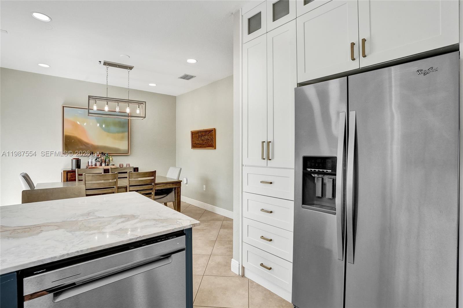 12554 Southwest 125th Terrace Miami, FL 33186 - Photo 16 of 41 a kitchen with stainless steel appliances a refrigerator and a stove