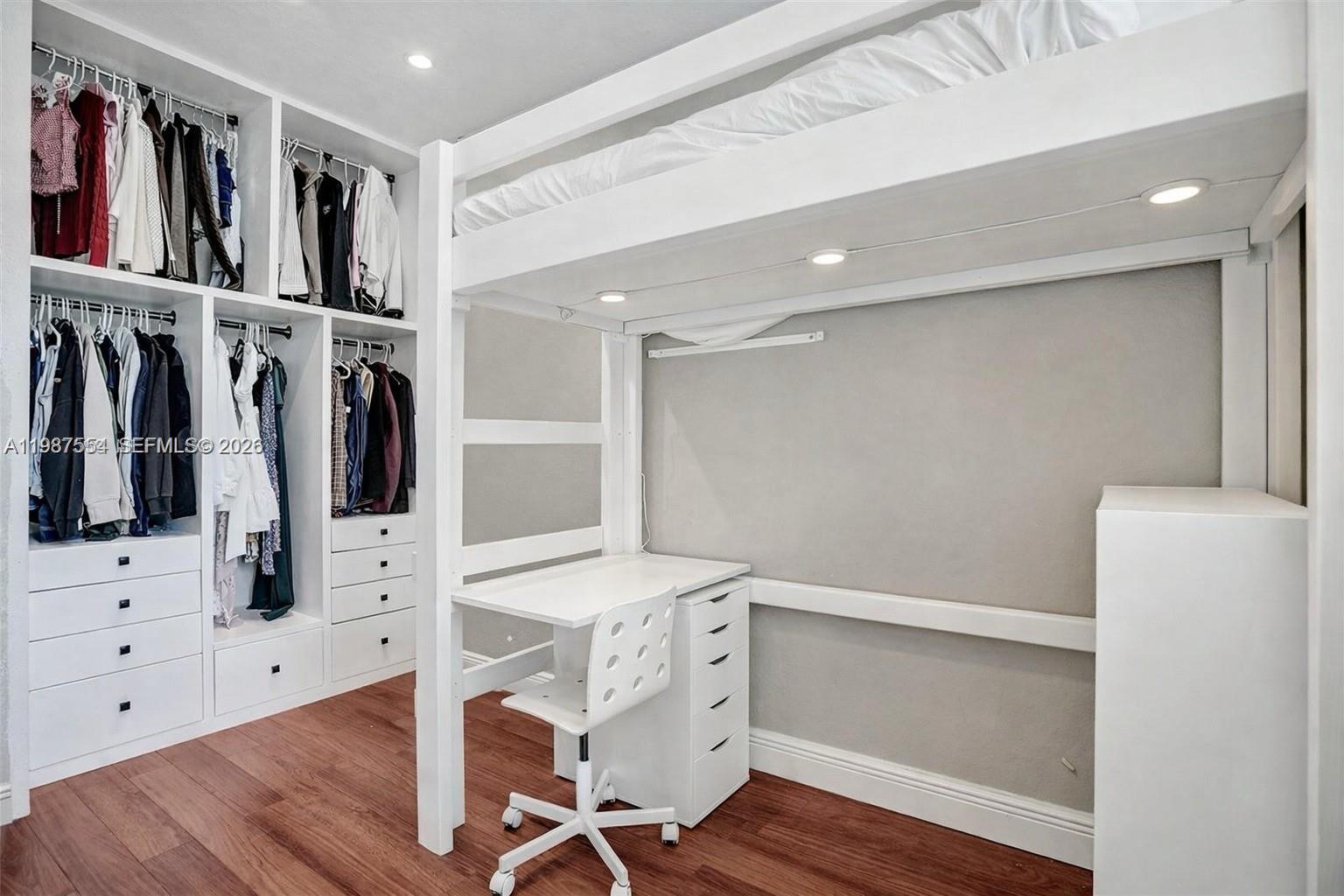 12554 Southwest 125th Terrace Miami, FL 33186 - Photo 29 of 41 a view of walk in closet with clothes and shoes