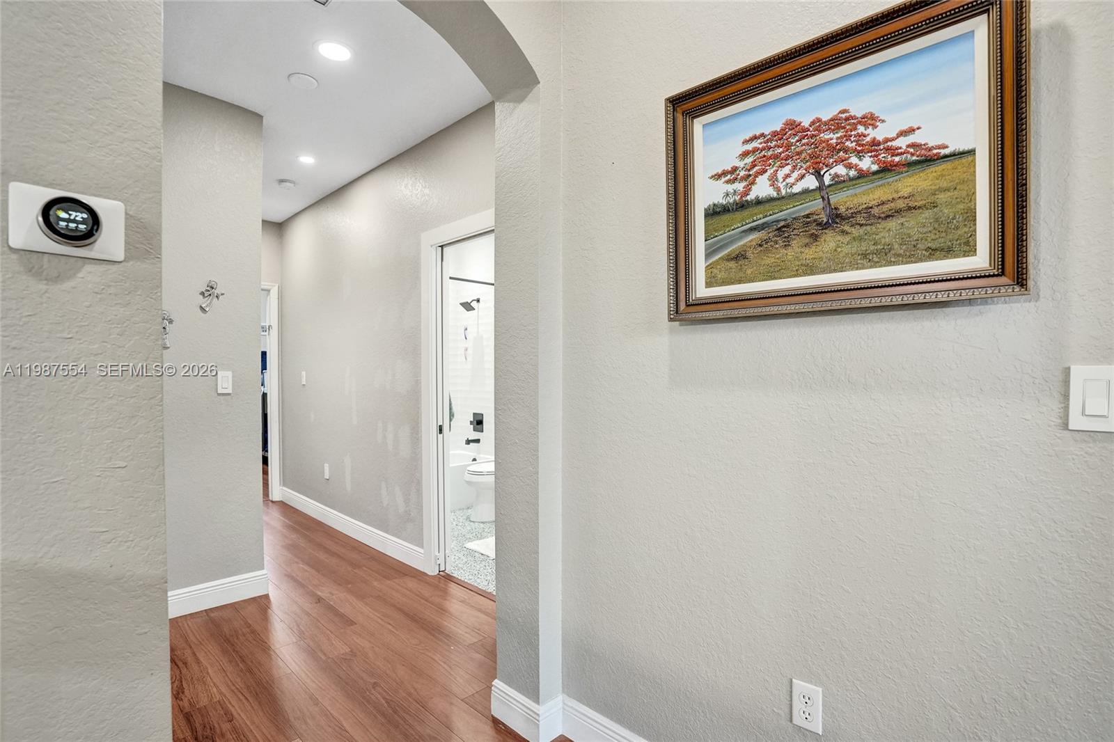 12554 Southwest 125th Terrace Miami, FL 33186 - Photo 32 of 41 a view of a hallway with wooden floor