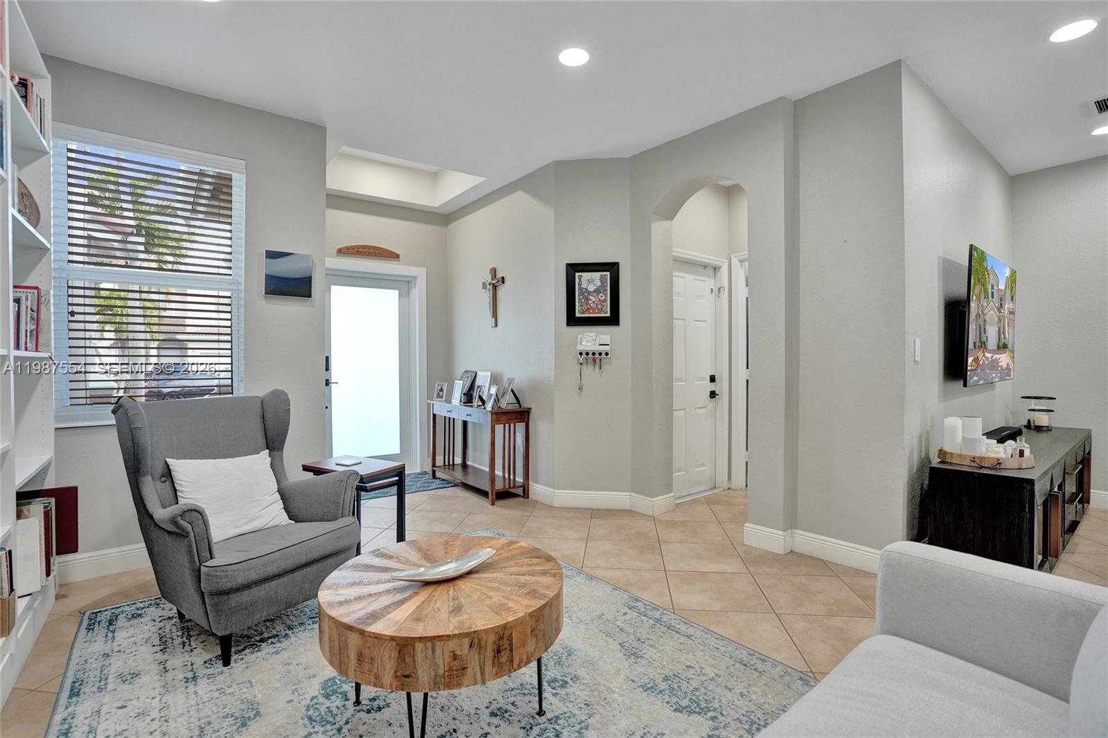 12554 Southwest 125th Terrace Miami, FL 33186 - Photo 5 of 41 a living room with furniture and a couch
