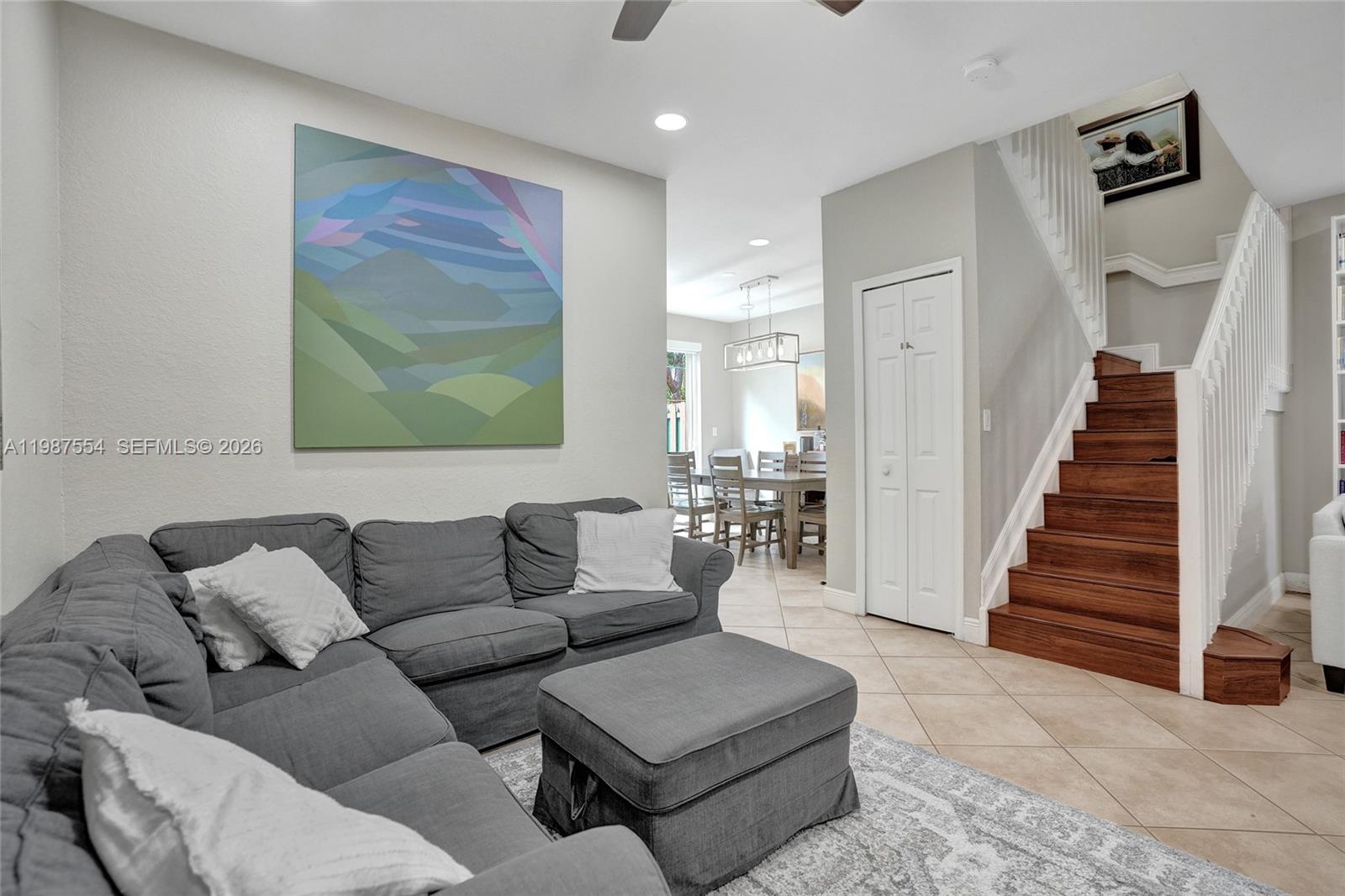 12554 Southwest 125th Terrace Miami, FL 33186 - Photo 9 of 41 a living room with furniture and a painting