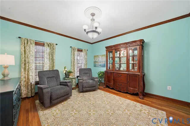 a bedroom with a bed and a large mirror with a bookshelf