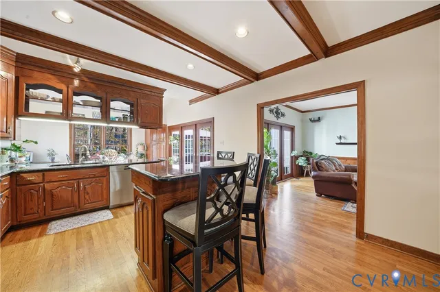 a view of staircase with railing and a rug