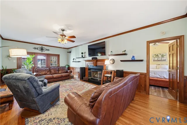 a view of deck with table and chairs under an umbrella with wooden floor