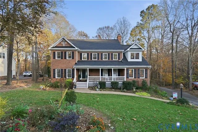 a spacious bathroom with a granite countertop double vanity sink and a mirror