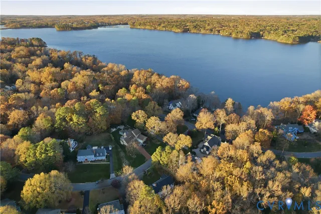 a dining room with furniture a rug and wooden floor