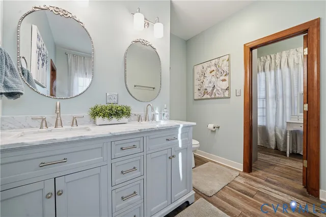a very nice looking dining room with kitchen island granite countertop a large kitchen island furniture and a chandelier