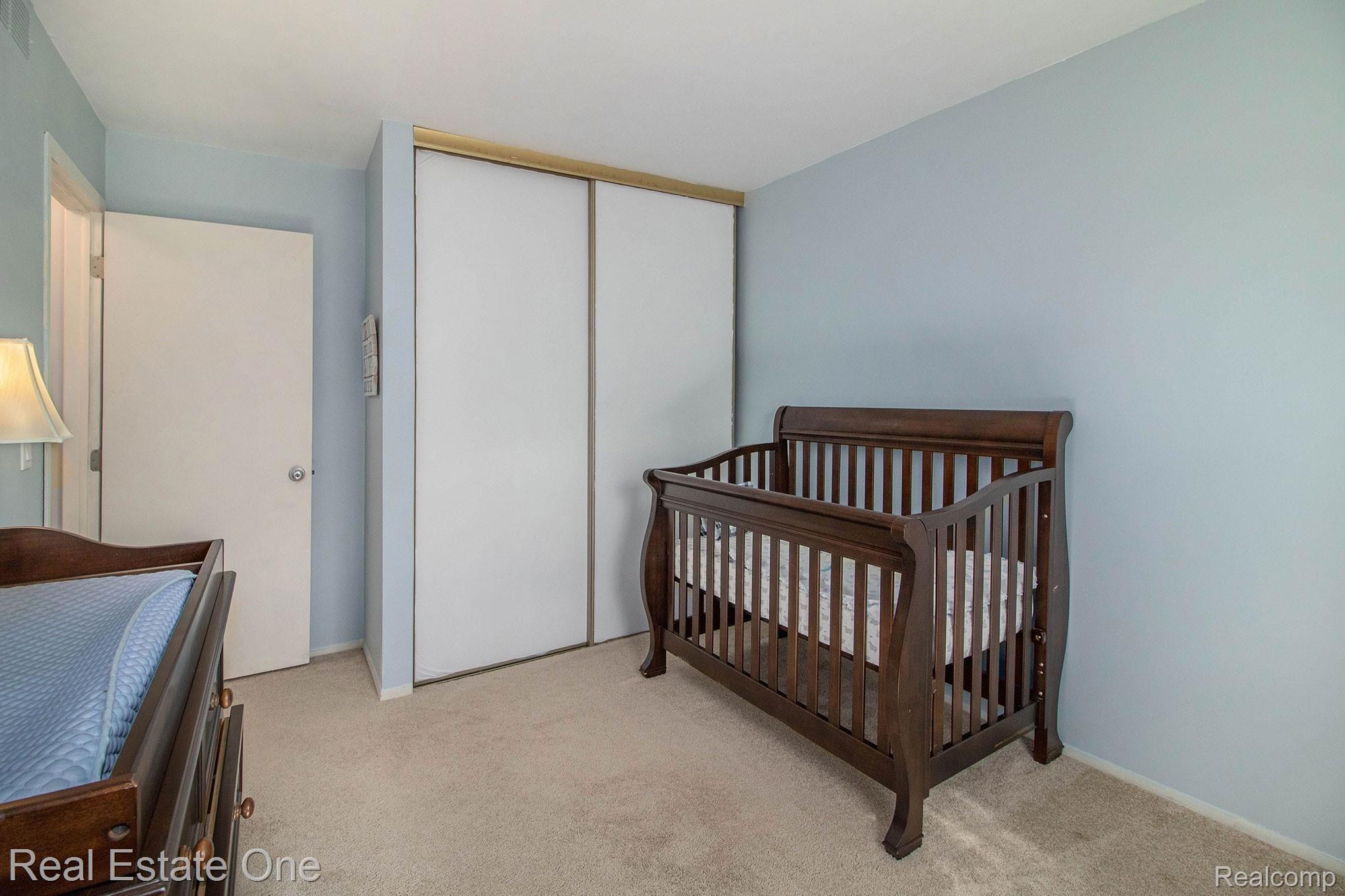 1296 Barneswood Lane Rochester, MI 48306 - Photo 19 of 32 Large and convenient closet with floor to ceiling sliding doors